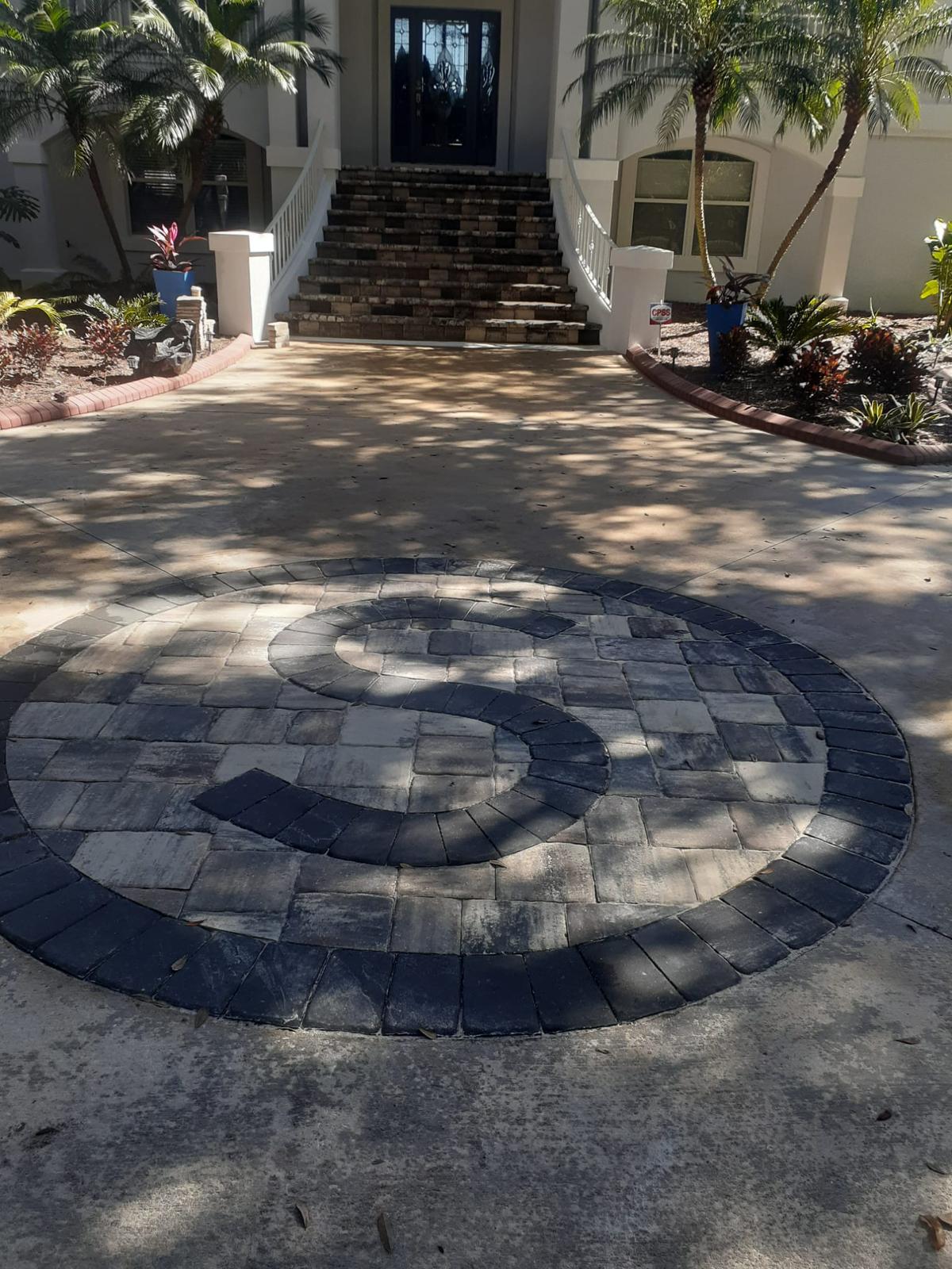 Custom paver driveway with monogram in Jacksonville